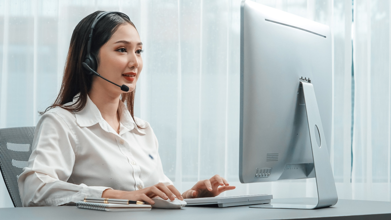Hardwood Floor Refinishing in south-west-london – friendly customer service advisor with headset booking a survey for oak hardwood plank floorboards, answering refinishing enquiries.