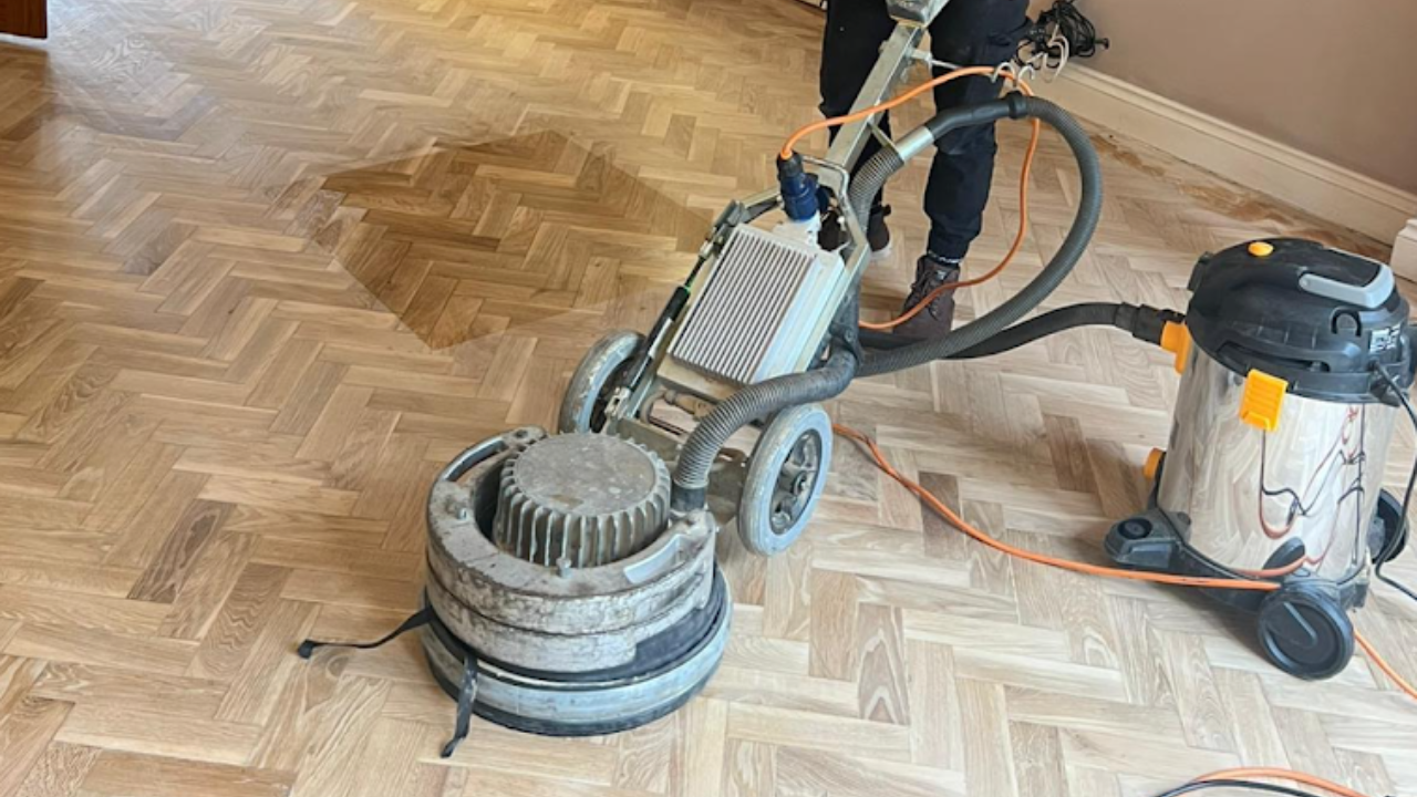 Parquet Floor Sanding in south-west-london on a light oak herringbone parquet wood floor, using a dust-free sanding machine and vacuum system.